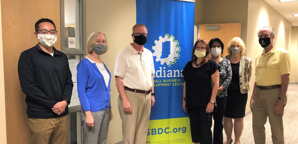 People with covid masks in front of SBDC