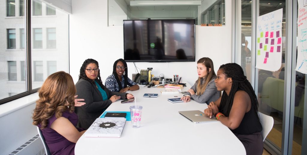 Five women in a business meeting